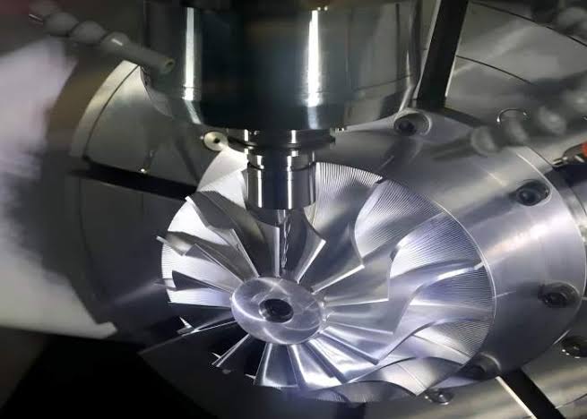 CNC machining a metal workpiece with a precision cutting tool